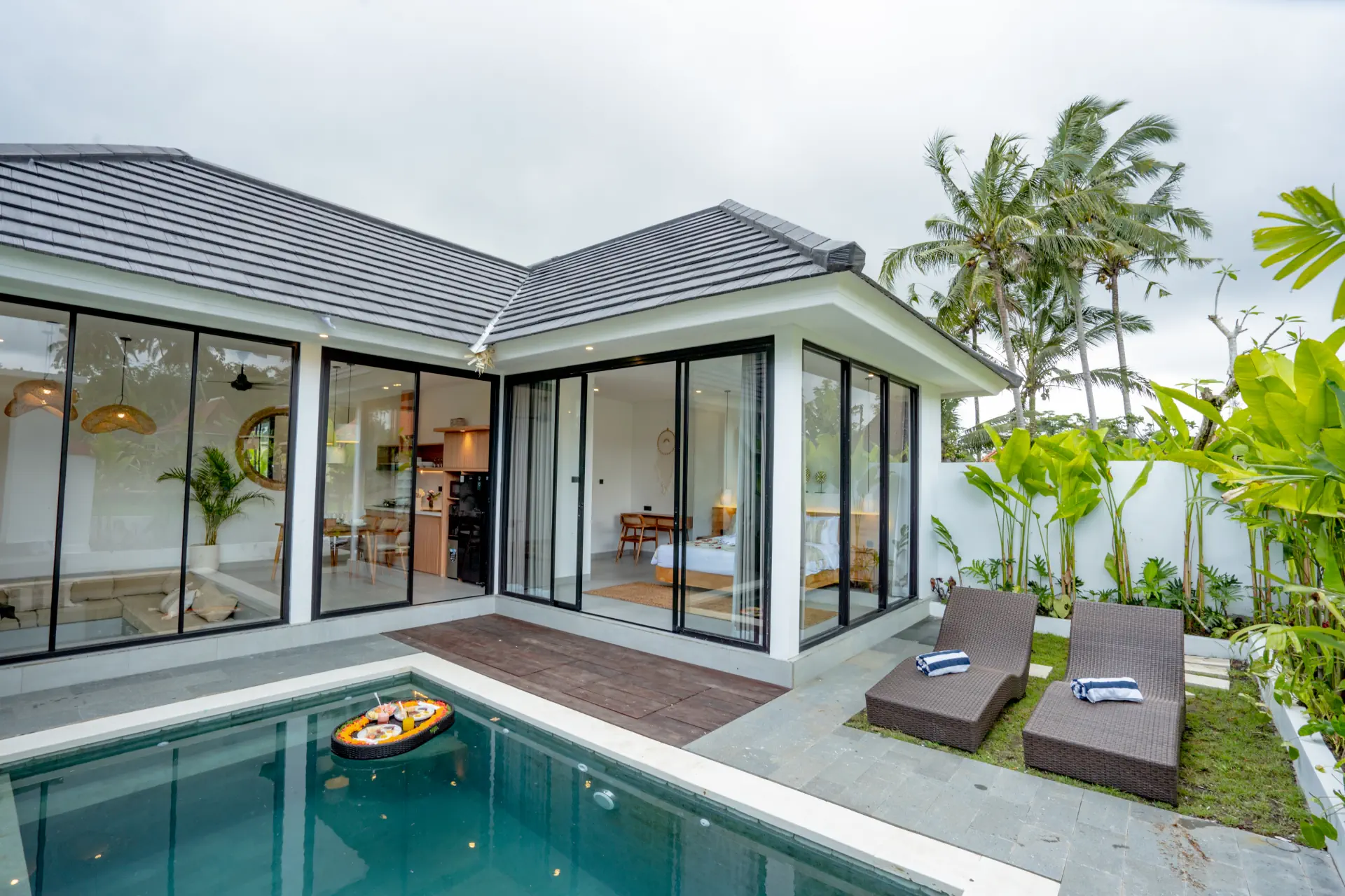 Infinity pool with floating breakfast at The Caka Ubud, a family villa near Saraswati Temple, Bali