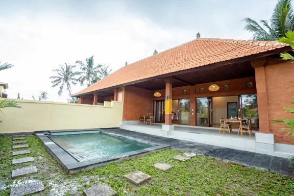Outdoor swimming pool and serene garden at The Jinggo 2-Bedroom Private Villa Ubud, Bali