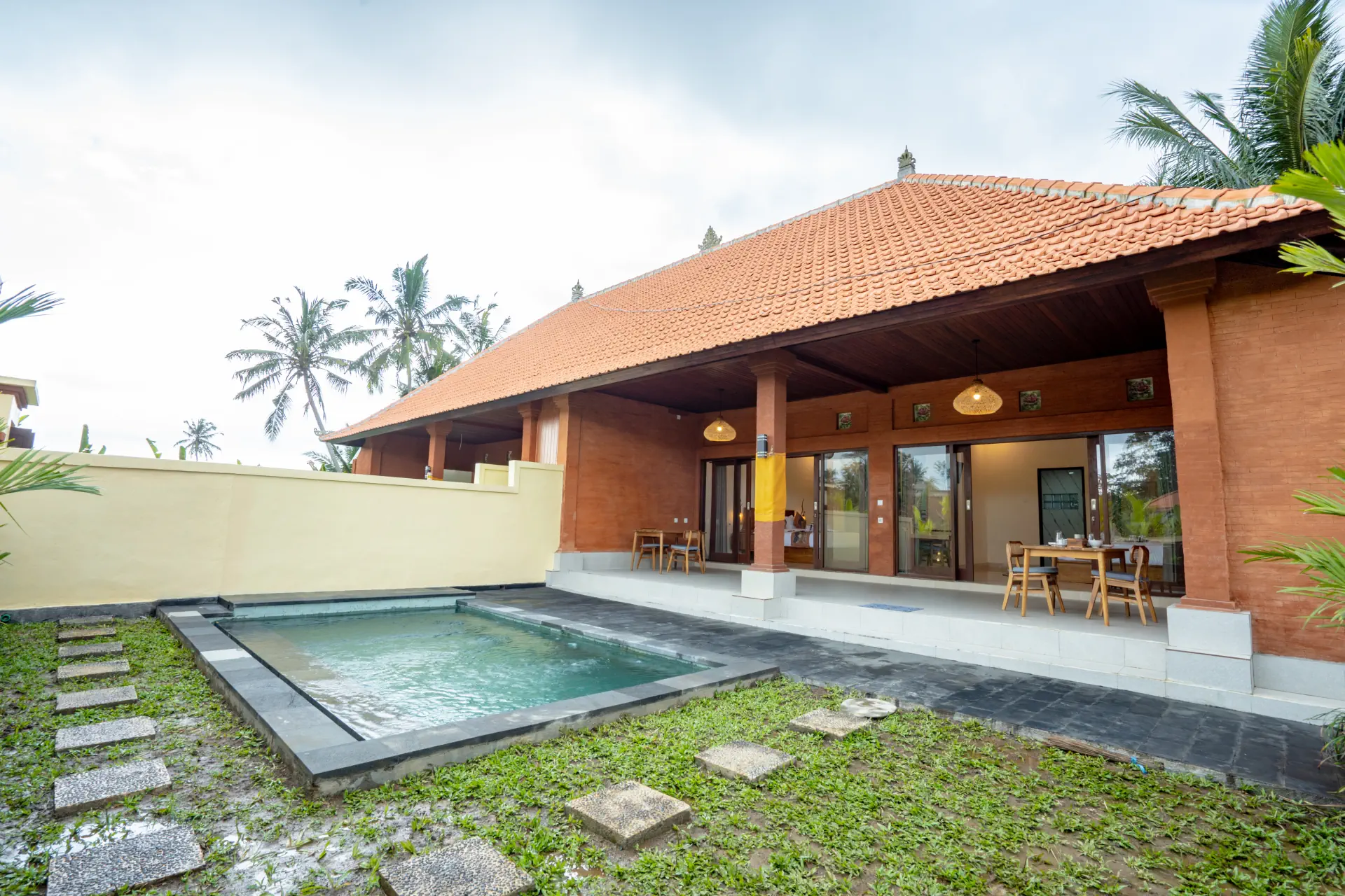 Outdoor swimming pool and serene garden at The Jinggo 2-Bedroom Private Villa Ubud, Bali