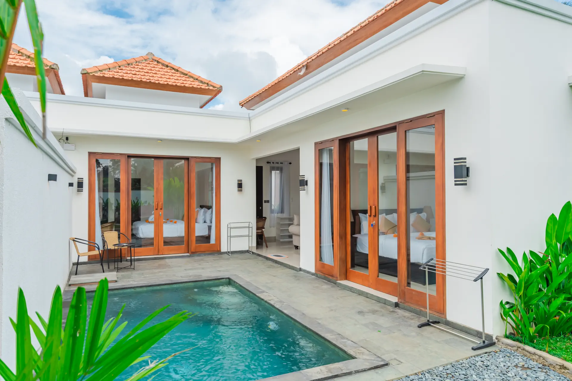 Infinity pool and sun terrace at The Tjindra Mata Ubud, a family villa with private balconies, Bali
